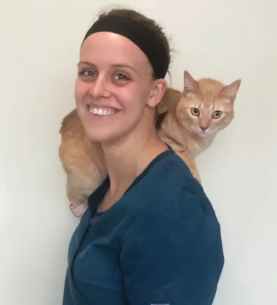 Bethany at Clocktower Animal Hospital, with cat on shoulders